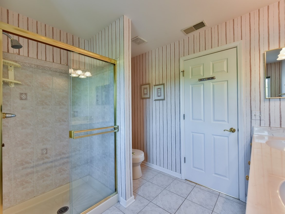3110 Crystal Rock Road Naperville, IL 60564 - Photo 21 of 27 a bathroom with a shower and toilet
