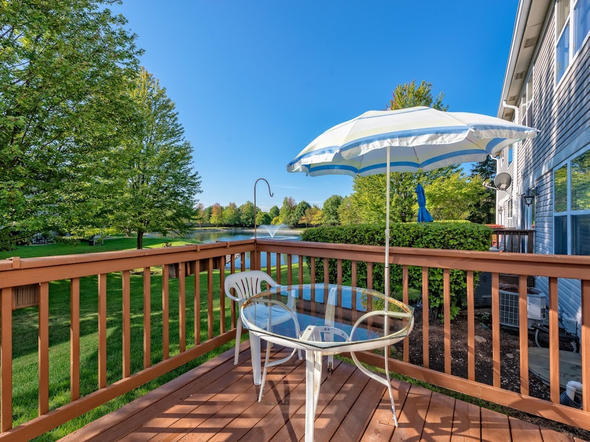 3110 Crystal Rock Road Naperville, IL 60564 - Photo 24 of 27 a view of a chair and table on the deck