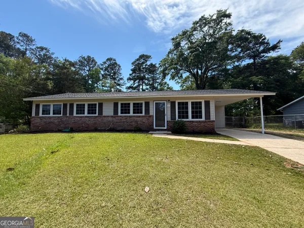 front view of a house with a yard