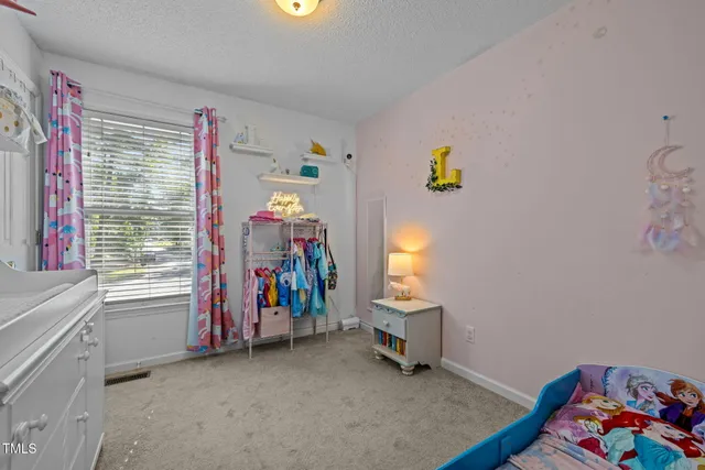 a view of a room with toys and a window