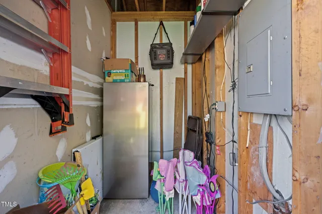 a bathroom with a sink mirror and curtain