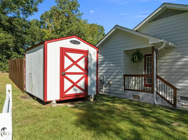 a backyard of a house with seating space