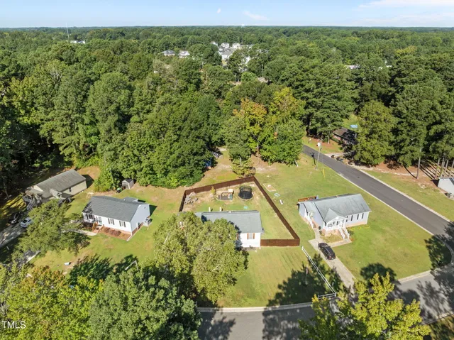 a view of a swimming pool with a yard