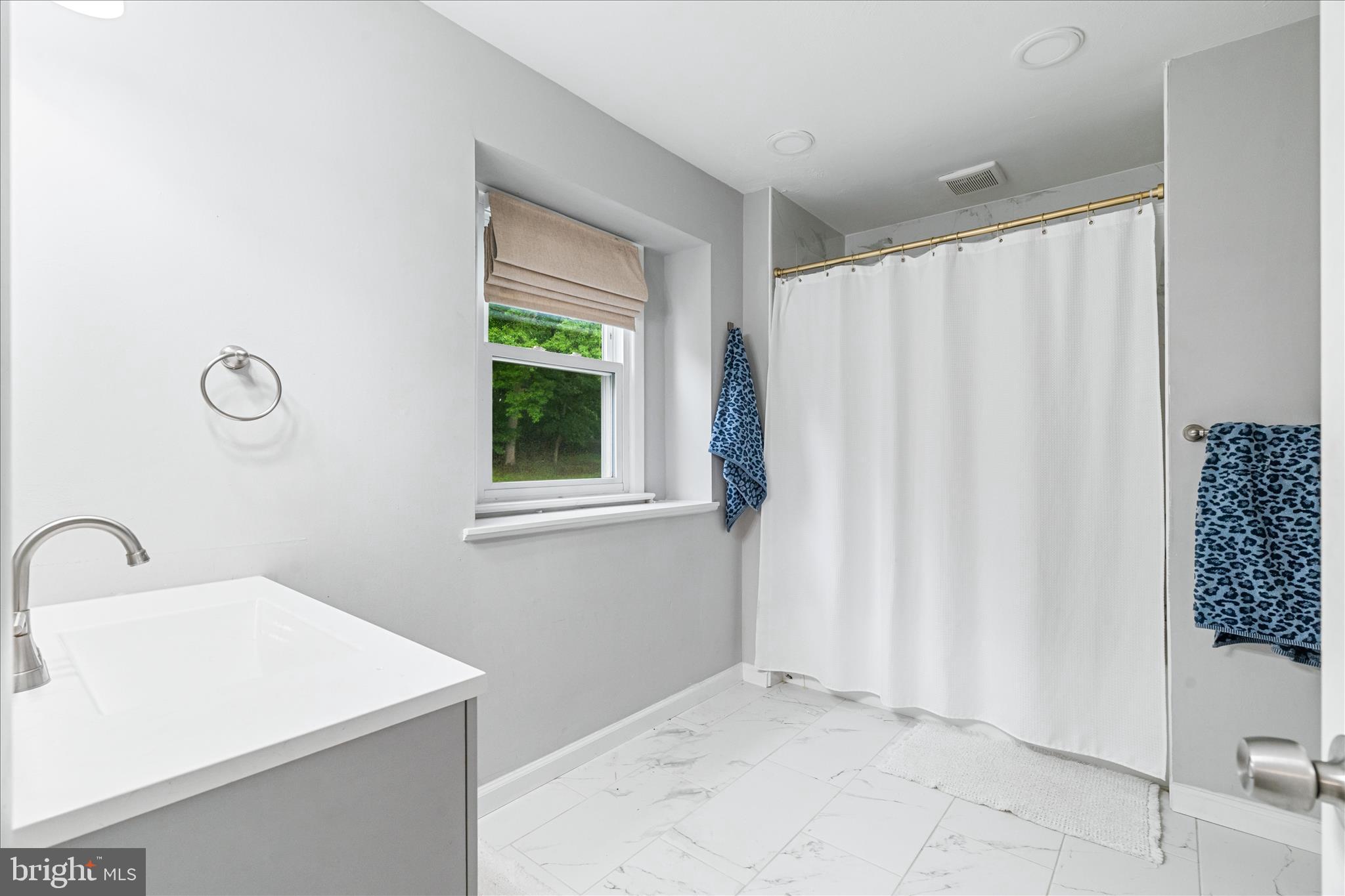 4217 Bill Moxley Road Mount Airy, MD 21771 - Photo 27 of 57 a bathroom with a sink and a mirror