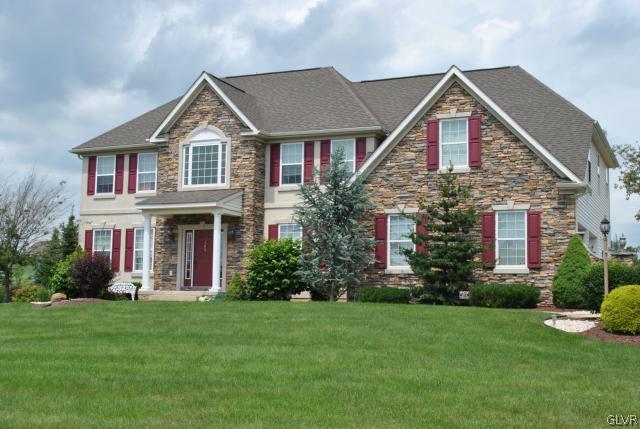 109 Fox Ridge Nazareth, PA 18064 - Photo 1 of 33 a front view of a house with a yard and trees