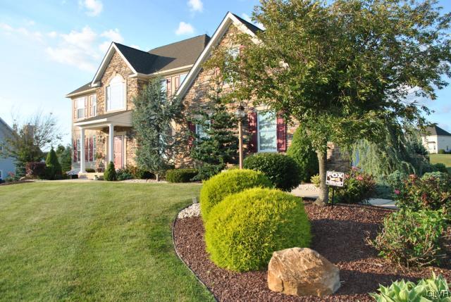 109 Fox Ridge Nazareth, PA 18064 - Photo 2 of 33 a front view of a house with a yard and garage