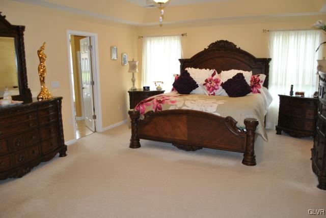 109 Fox Ridge Nazareth, PA 18064 - Photo 21 of 33 a bedroom with a bed and a fireplace