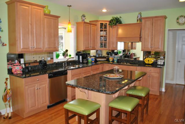 109 Fox Ridge Nazareth, PA 18064 - Photo 10 of 33 a kitchen with a table chairs and a sink