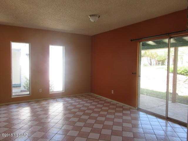 403 Curry Street Rio Rico, AZ 85648 - Photo 3 of 23 a view of an empty room with glass door