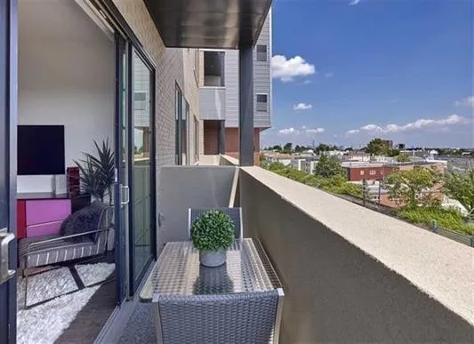 wooden floor in an empty room with a mirror
