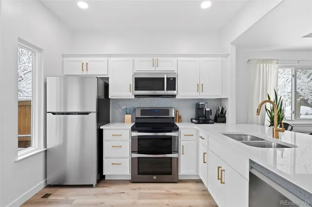 a kitchen with a stove and a refrigerator