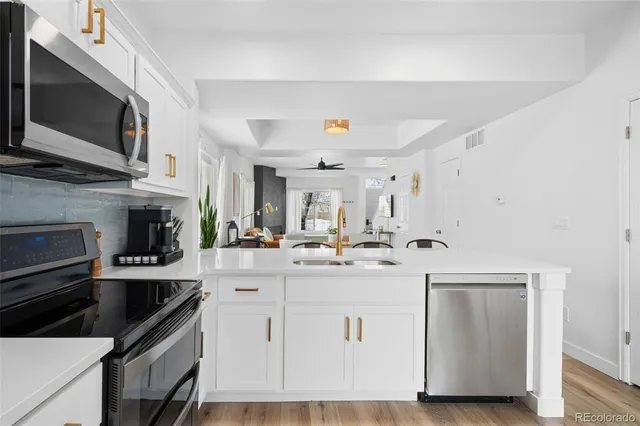 a kitchen with a sink and cabinets