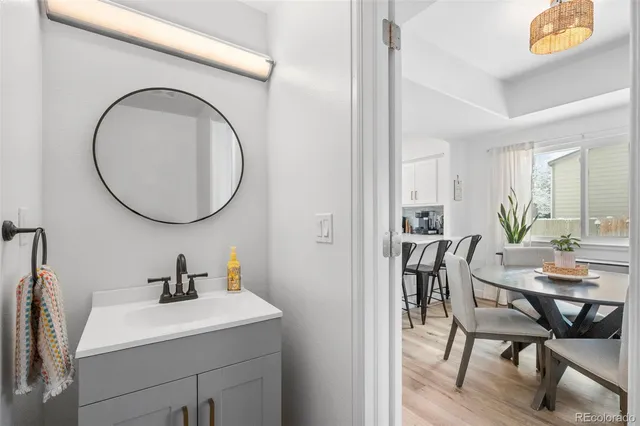 a view of a dining room with furniture and a mirror
