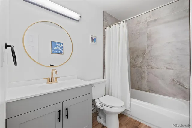 a bathroom with a sink a toilet and a bathtub