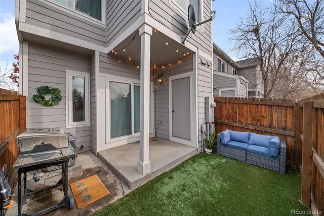 a view of backyard with outdoor seating