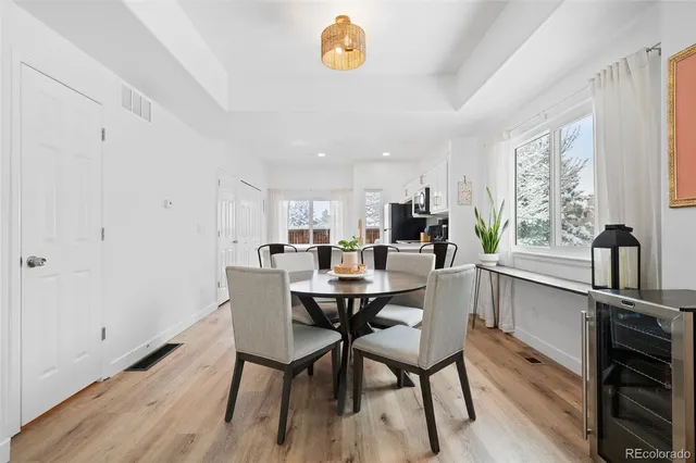 a view of a dining room with furniture and a window