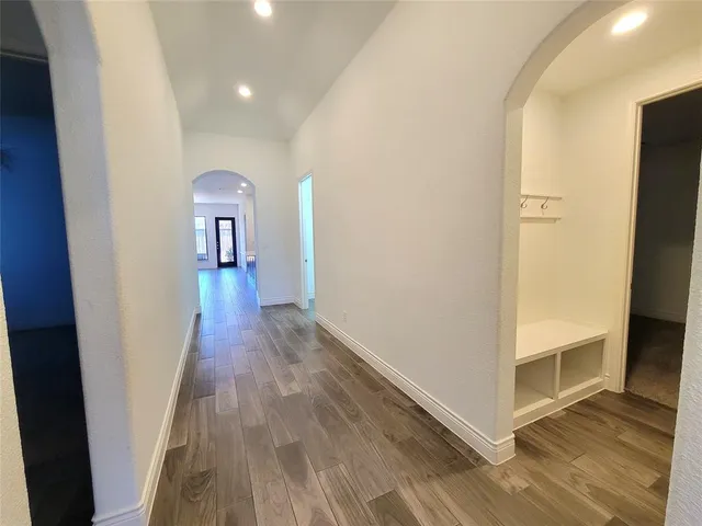 wooden floor in a hall with an entryway