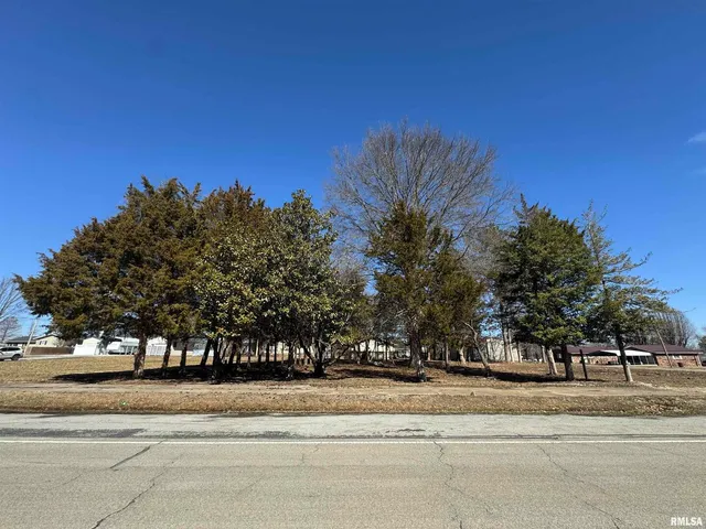 a view of a fountain is middle of the road