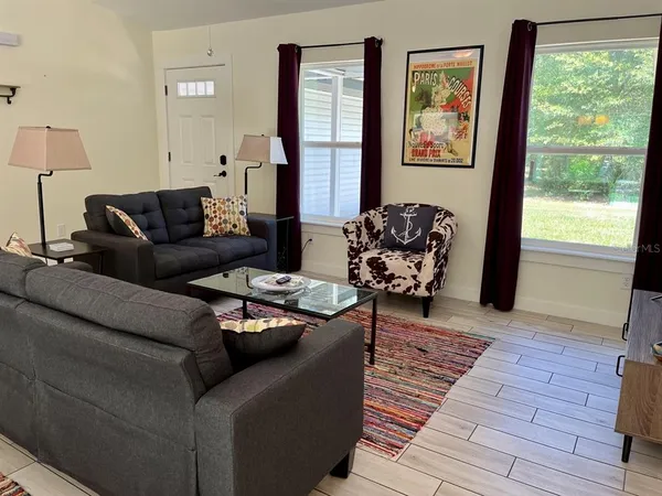 a living room with furniture and a window