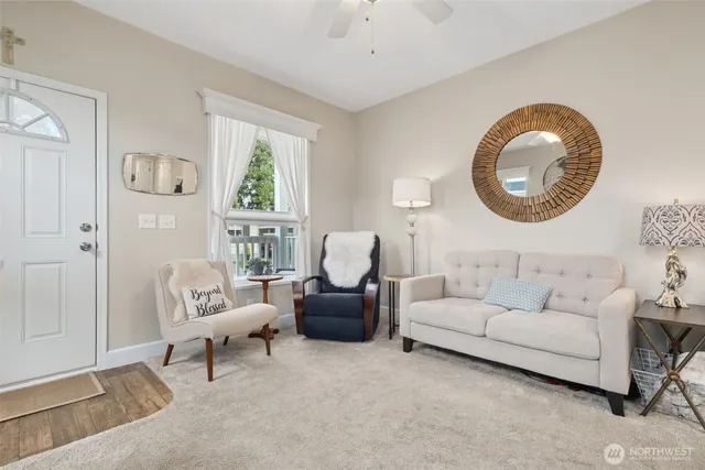 a living room with furniture and a large window