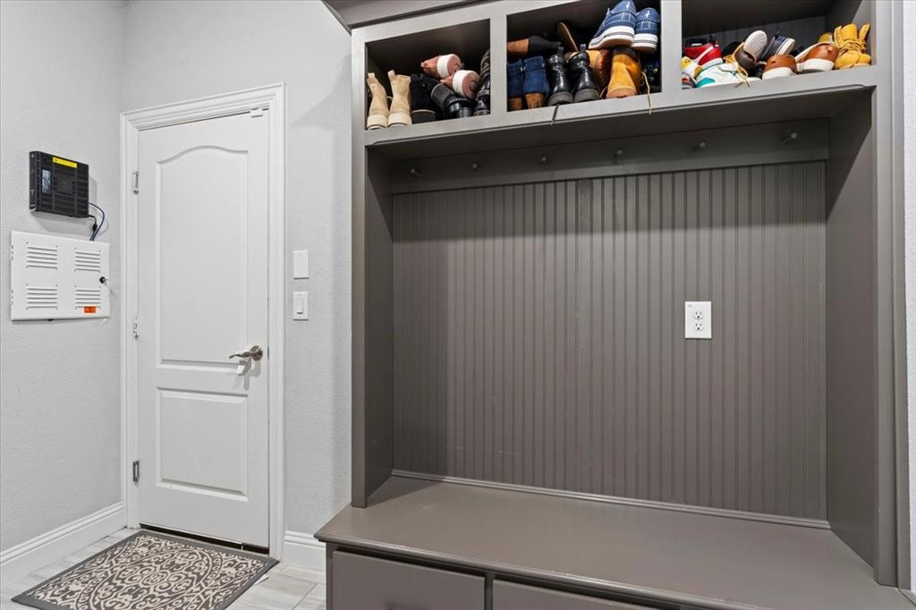 620 Shadow Trail Frisco, TX 75033 - Photo 35 of 36 Built-in mudroom bench with beadboard backing, overhead shelving, and integrated storage drawers