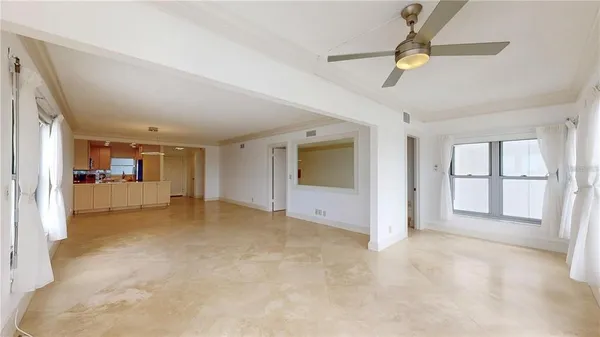 a kitchen with stainless steel appliances granite countertop a sink a stove and white cabinets