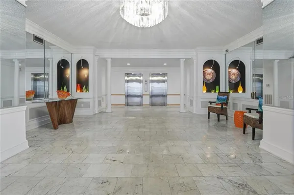 a spacious bedroom with a bed and a window