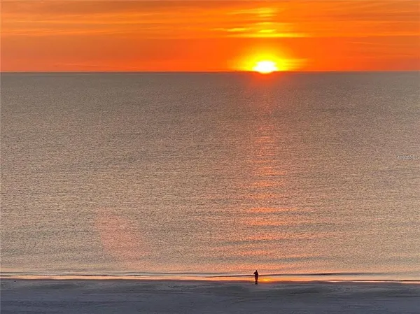 a view of a balcony with wooden floor and city view