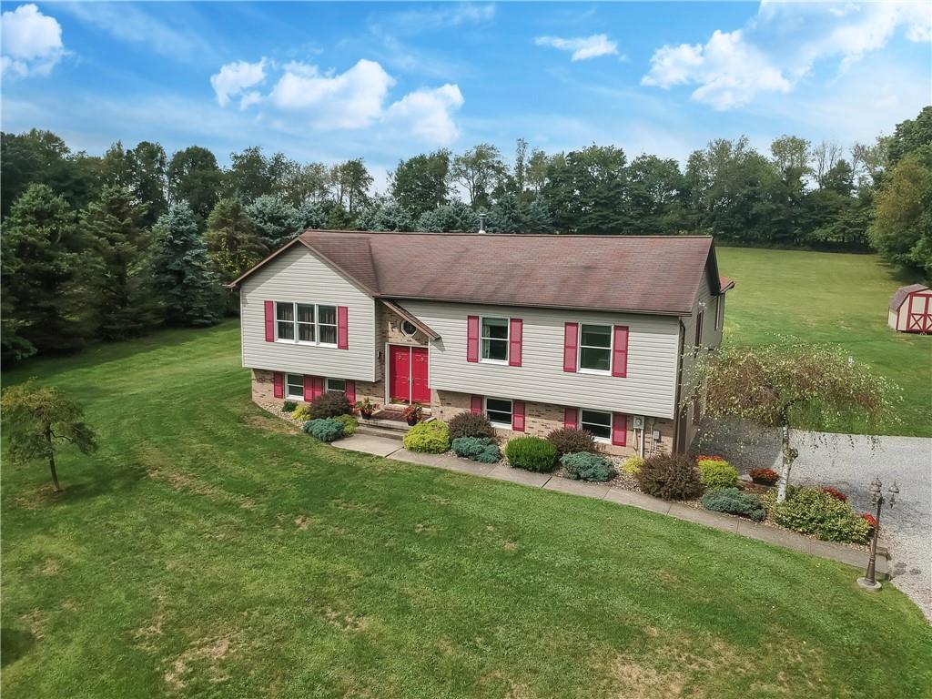 135 Staff Road Slippery Rock, PA 16057 - Photo 1 of 25 a aerial view of a house with yard and green space
