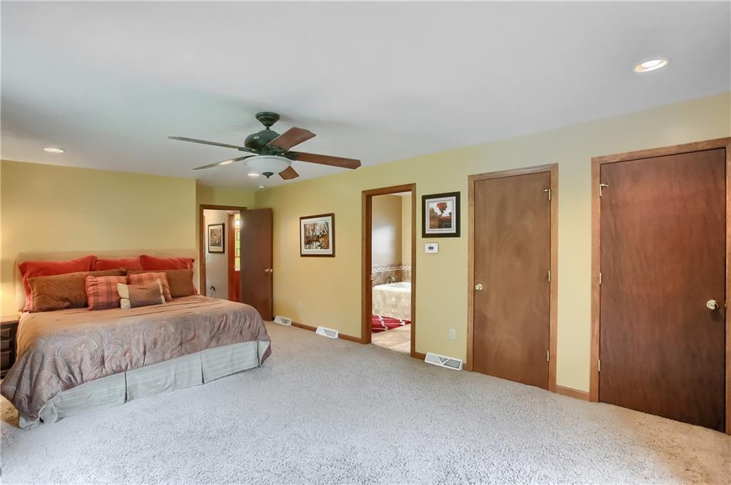 135 Staff Road Slippery Rock, PA 16057 - Photo 18 of 25 a bedroom with a bed and a chandelier