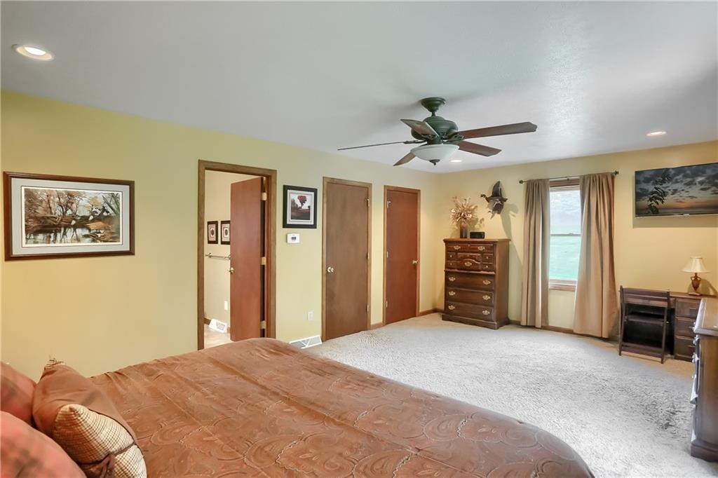 135 Staff Road Slippery Rock, PA 16057 - Photo 19 of 25 a bedroom with a bed and a chandelier