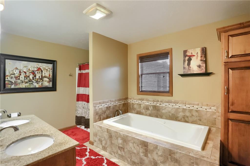 135 Staff Road Slippery Rock, PA 16057 - Photo 20 of 25 a bath tub sitting next to a bathroom sink