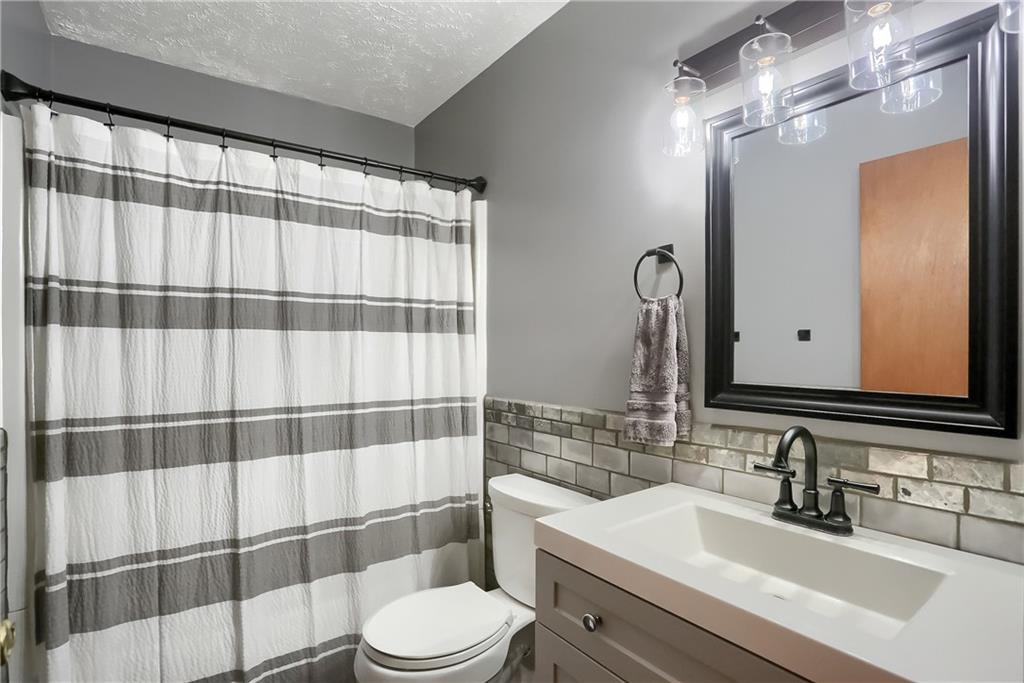 135 Staff Road Slippery Rock, PA 16057 - Photo 23 of 25 a bathroom with a sink a toilet and shower