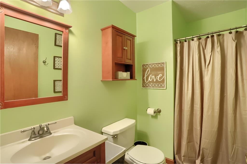 135 Staff Road Slippery Rock, PA 16057 - Photo 24 of 25 a bathroom with a sink mirror and toilet