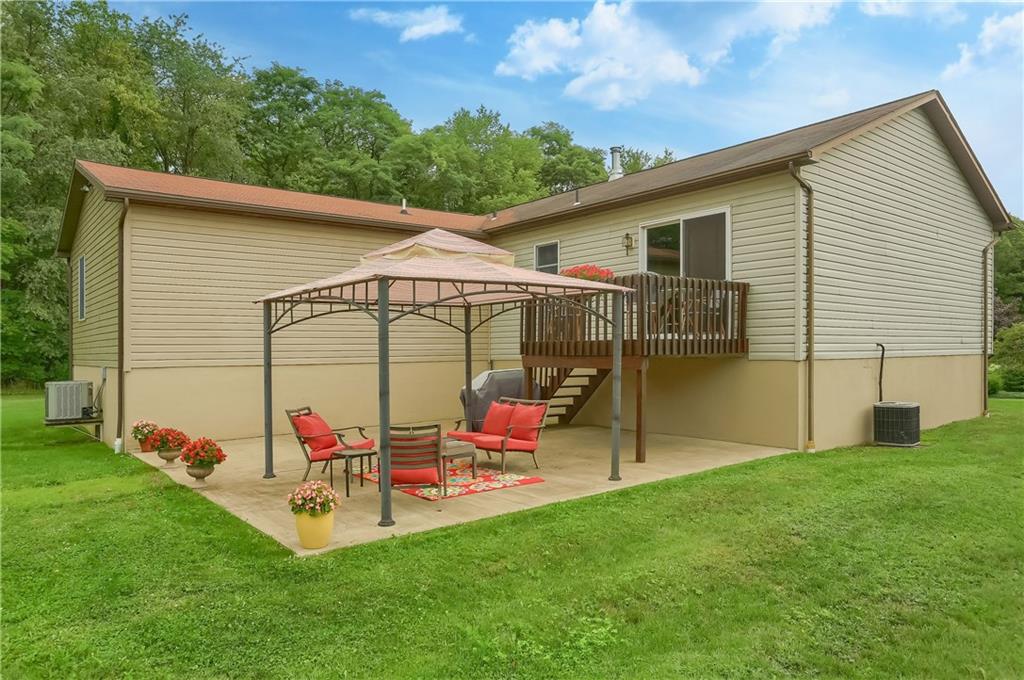 135 Staff Road Slippery Rock, PA 16057 - Photo 25 of 25 a backyard of a house with table and chairs