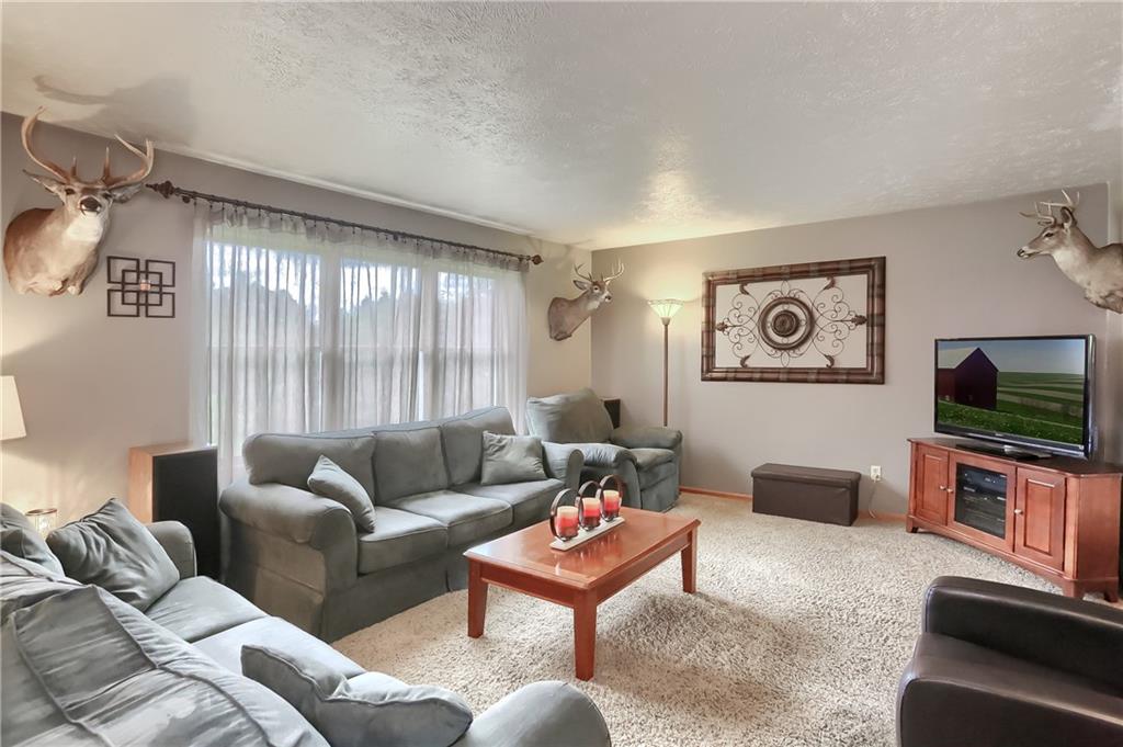 135 Staff Road Slippery Rock, PA 16057 - Photo 4 of 25 a living room with furniture and a flat screen tv