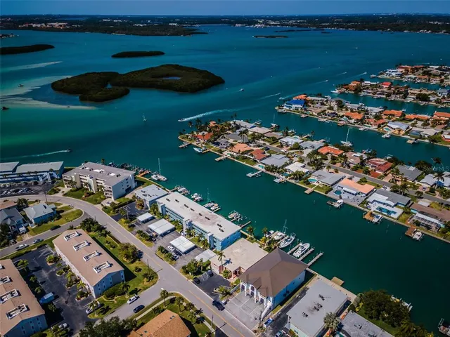 an aerial view of a house with a lake view