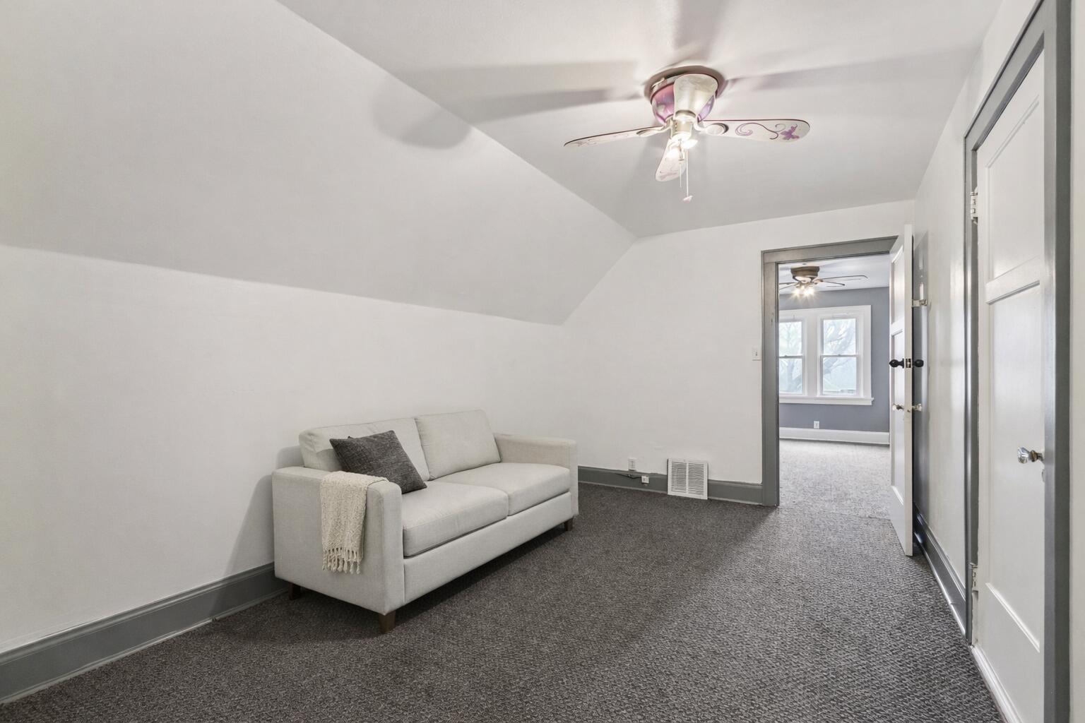 4073 North 16th Street Milwaukee, WI 53209 - Photo 17 of 25 Cozy modern room with sloped ceiling