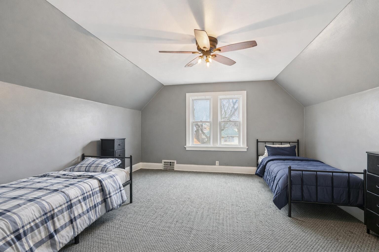 4073 North 16th Street Milwaukee, WI 53209 - Photo 18 of 25 Cozy bedroom with twin beds and natural