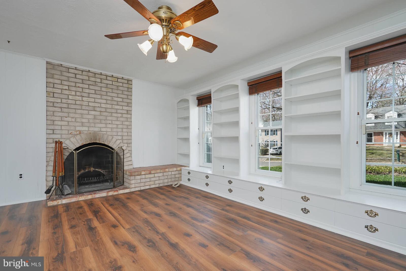12517 Kuhl Road Silver Spring, MD 20902 - Photo 32 of 55 LVP flooring and built-in shelving