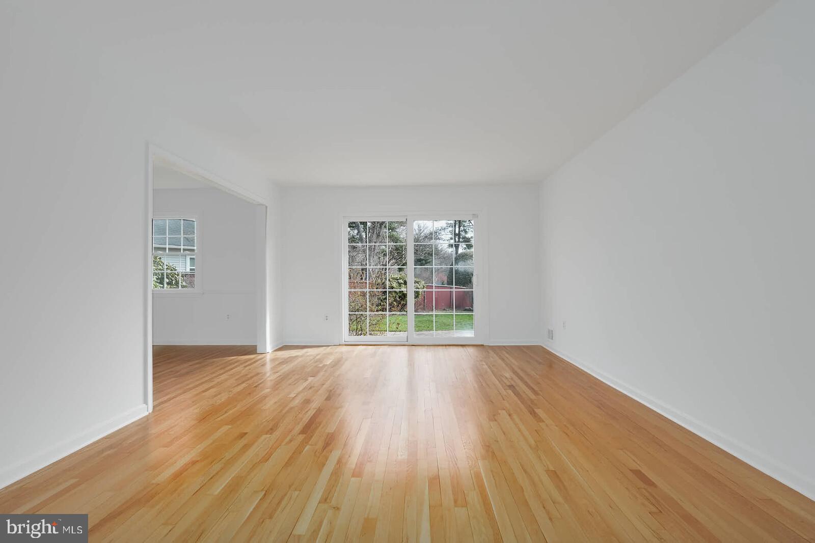 12517 Kuhl Road Silver Spring, MD 20902 - Photo 5 of 55 Bright living room with sliders to patio & yard