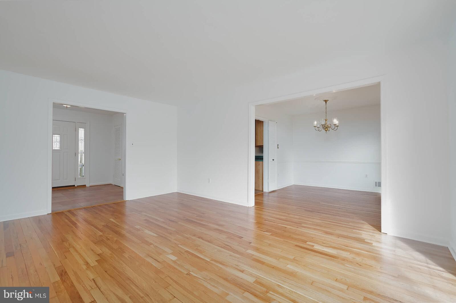 12517 Kuhl Road Silver Spring, MD 20902 - Photo 7 of 55 Living room toward foyer and dining room