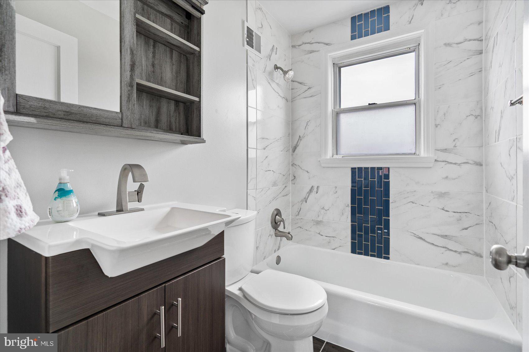 2230 Firethorn Road Baltimore, MD 21220 - Photo 20 of 35 Upper Level Bathroom with custom tile work