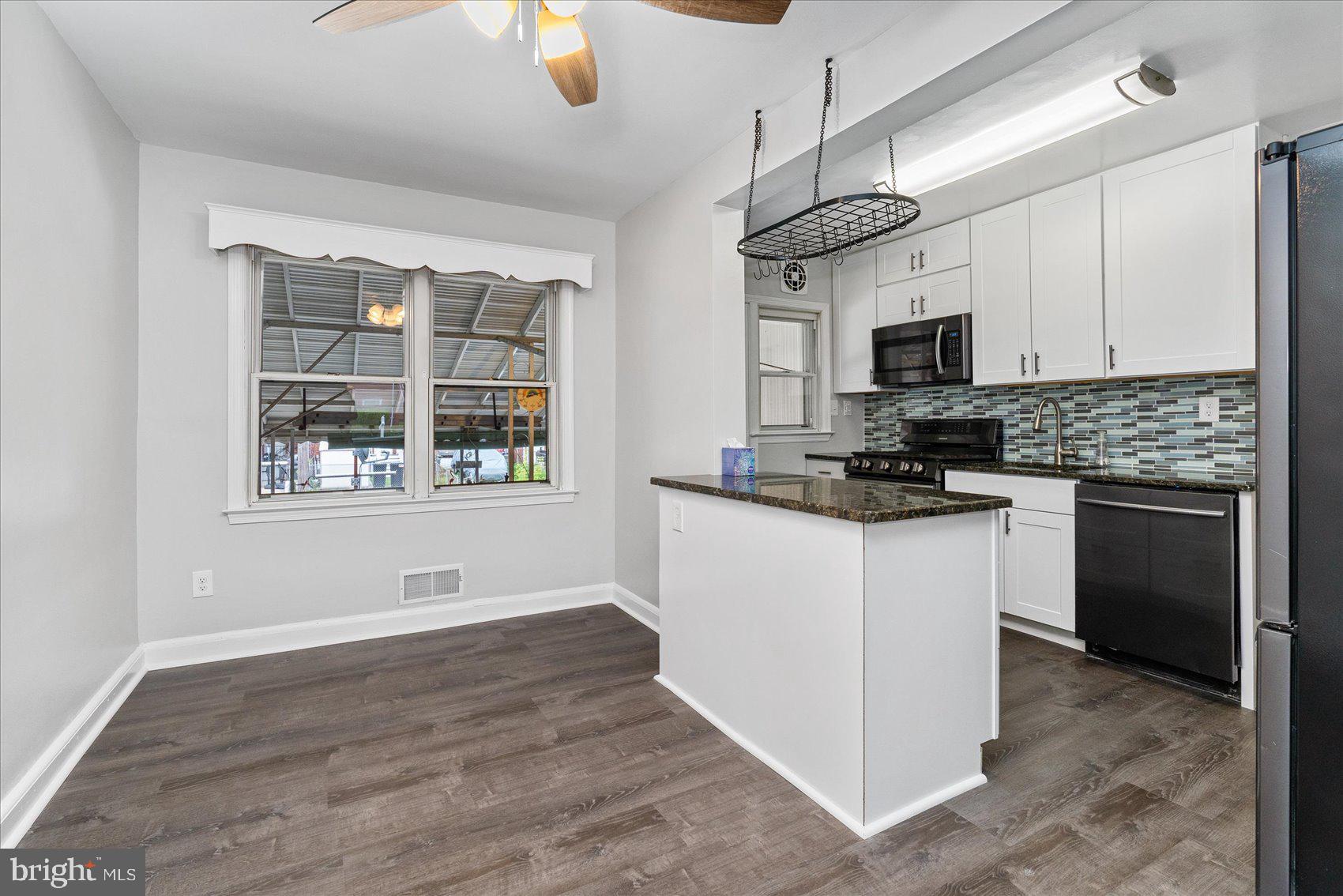2230 Firethorn Road Baltimore, MD 21220 - Photo 8 of 35 Dining Room and Kitchen with Island