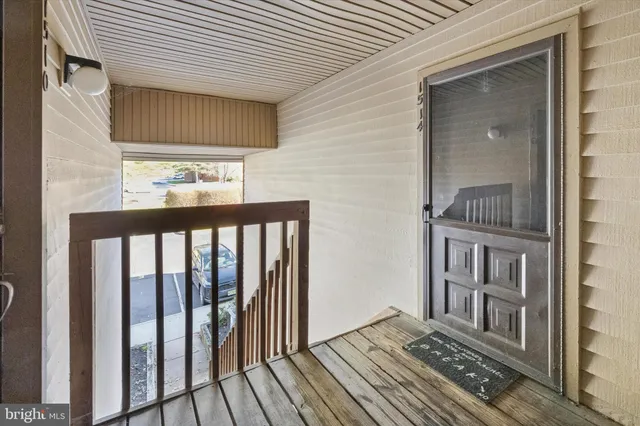 a view of a balcony with wooden floor