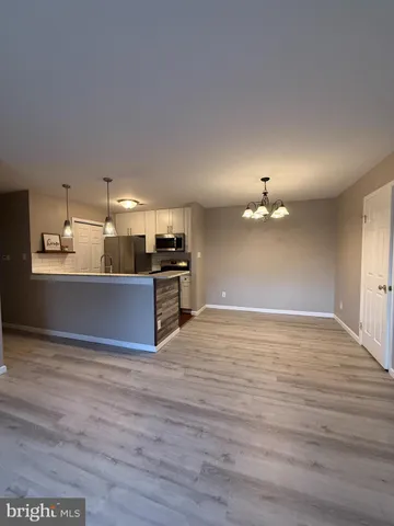 a view of kitchen with wooden floor
