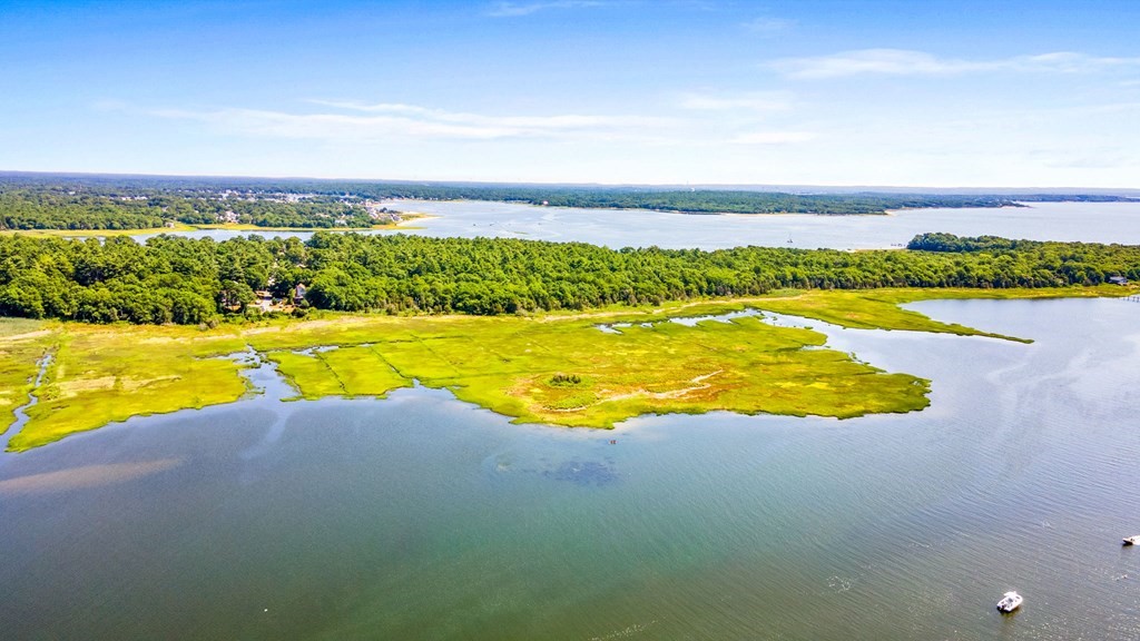 0 Cromesett Road Wareham, MA 02571 - Photo 4 of 9 a view of a swimming pool and an ocean