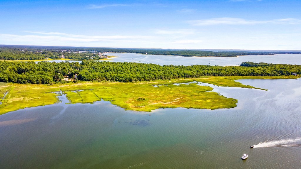 0 Cromesett Road Wareham, MA 02571 - Photo 5 of 9 a view of a swimming pool with an ocean view