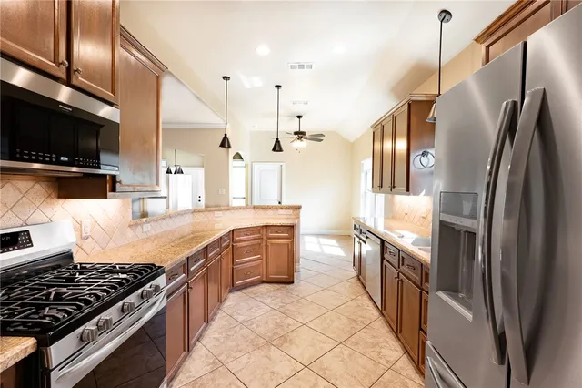 a bathroom with a granite countertop sink mirror and shower