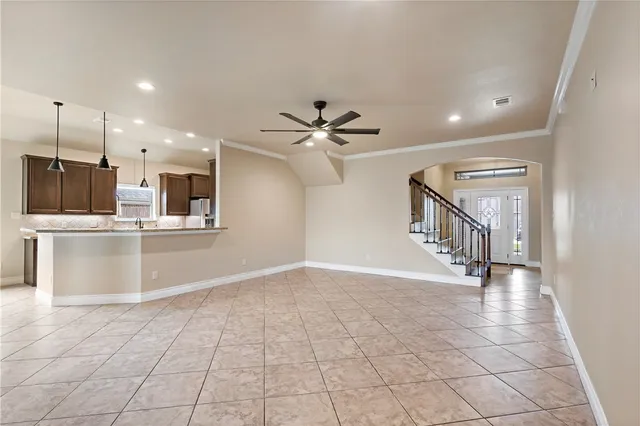 a kitchen with stainless steel appliances granite countertop a stove and a sink